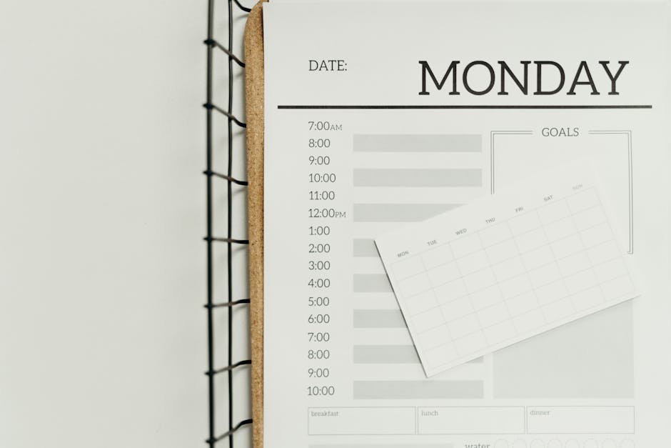 Top view of a minimalist schedule planner with Monday header. Perfect for organizing daily tasks with goals section.