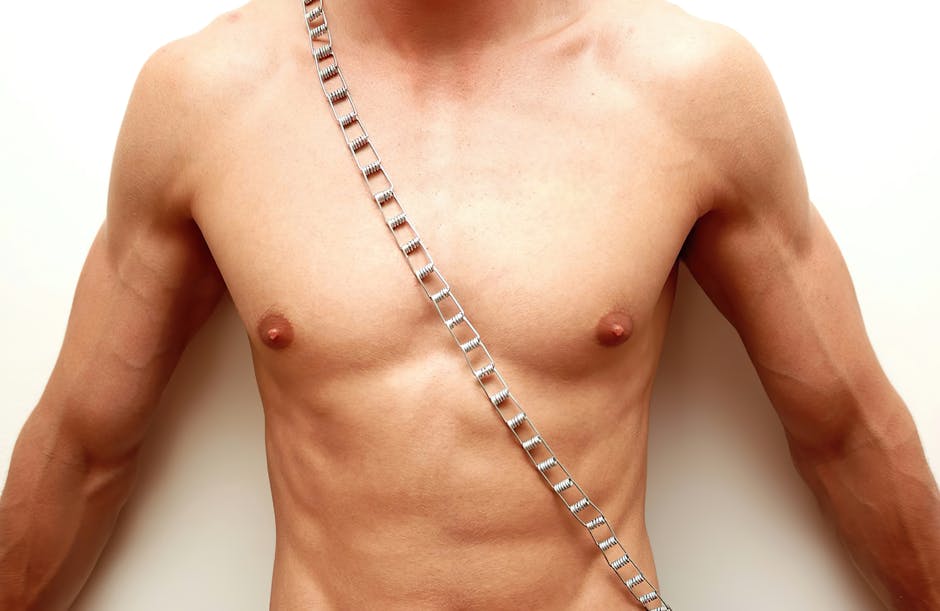 Plain white t-shirt on a hanger against a minimalist white backdrop with shadows.