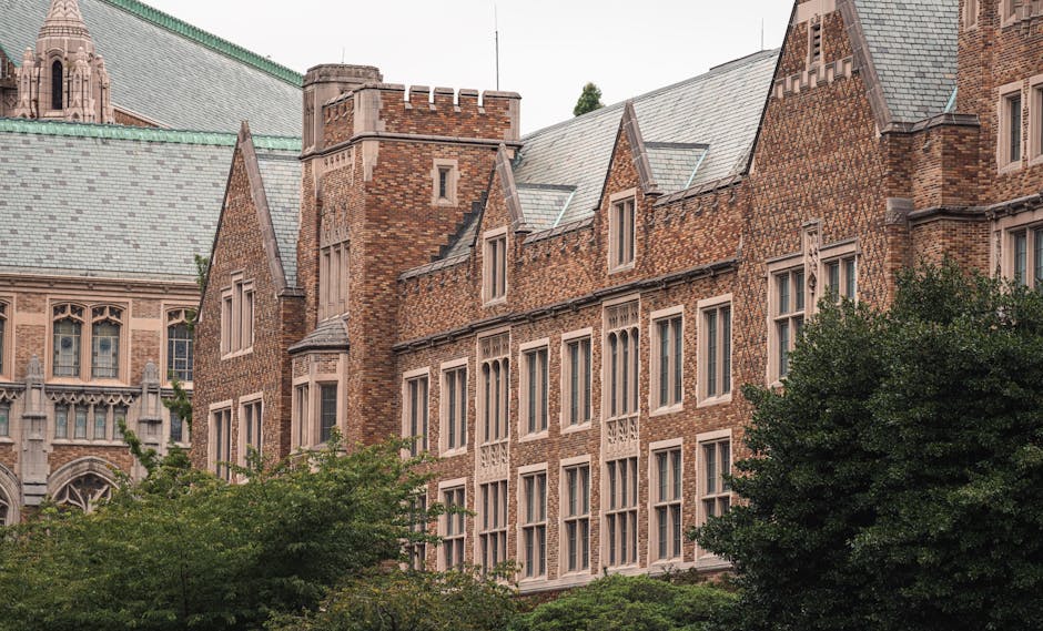 View of historic brick building with slate roofs and Gothic architectural features.