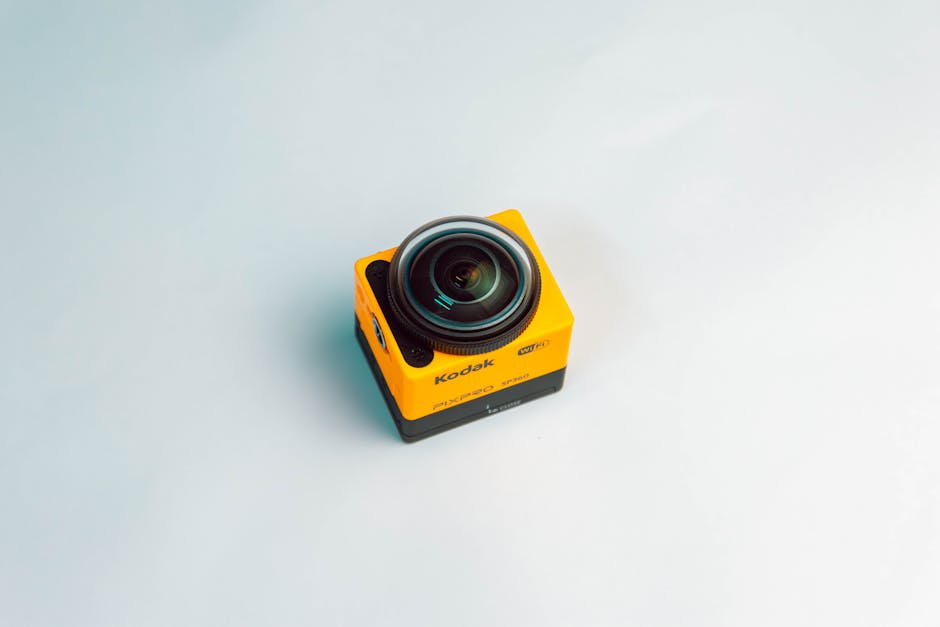 A close-up view of Kodak Pixpro SP360 sports camera with a wide lens on a clean white background.